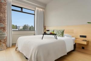 Voodi või voodid majutusasutuse Arctic Comfort Hotel toas