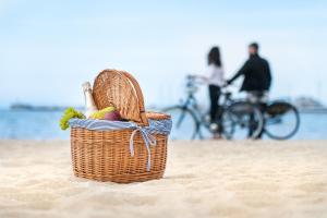 a basket of fruit sitting on a beach at Rezydent Hotel Sopot - MGallery Collection in Sopot +148 photos