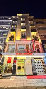 a tall building with a store in front of it at Efendi Hotel old town special category in Istanbul