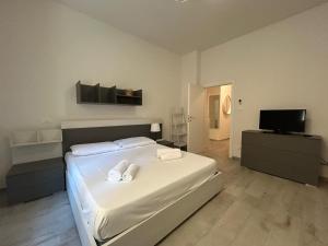 Ένα ή περισσότερα κρεβάτια σε δωμάτιο στο Piave Room & Relax