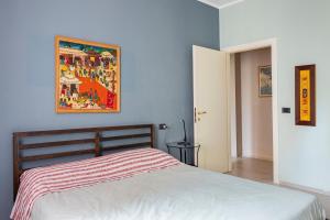 Ένα ή περισσότερα κρεβάτια σε δωμάτιο στο Appartamento tra Museo Ferrari, stazione e centro +10 φωτογραφίες