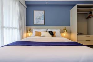 Postel nebo postele na pokoji v ubytování Charlie Wonder Ipiranga + 35 fotografií