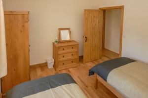 En eller flere senge i et værelse på Bryncaled