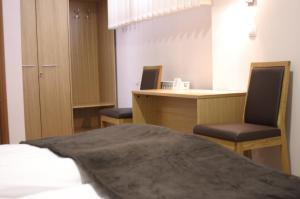 Postel nebo postele na pokoji v ubytování Rooms Virovitica