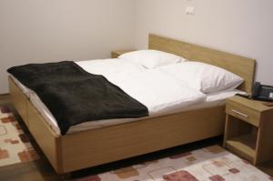 Postel nebo postele na pokoji v ubytování Rooms Virovitica