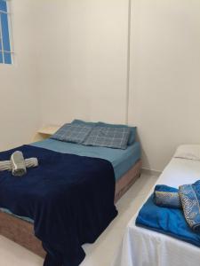 Ένα ή περισσότερα κρεβάτια σε δωμάτιο στο Centro, ap novo, coração de BH, conforto e acesso