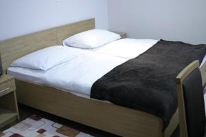 Postel nebo postele na pokoji v ubytování Rooms Virovitica