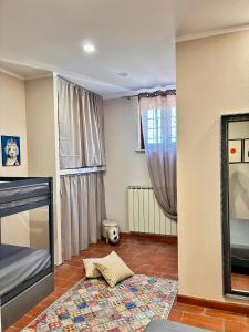a living room with a bed and a window at Apartment In Villa With Pool On Umbrian Hills in Stroncone