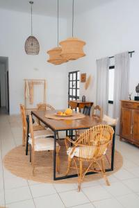 a dining room with a table and chairs at Quinta do Vale Entire Property in São Bartolomeu de Messines