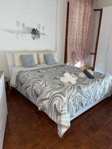 a bed with two phones on it in a room at B&B L'Orchidea in Pisa +29 photos