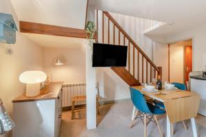 a kitchen and dining room with a table and a tv at 2 Bed in Ingleton oc-n33612 in Ingleton 