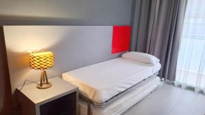 Ένα ή περισσότερα κρεβάτια σε δωμάτιο στο Apolo Suites Rentalmar +16 φωτογραφίες