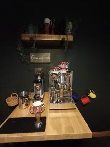 a counter with a coffee maker on a wooden table at Dog friendly holiday home Acharacle sleeps 6 in Acharacle