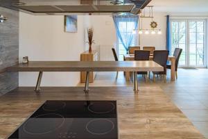 a dining room with a large wooden table and a dining room at Ferienhaus Rerik Piratenlager in Rerik