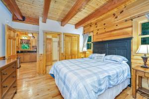 a bedroom with a bed and a wooden ceiling at Among the Laurels- Private Hot Tub and Fire Pit in Fleetwood
