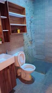 a bathroom with a toilet and a sink at Appartement Aéroport Sunset Marrakech in Marrakesh +12 photos