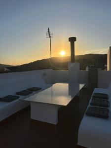a view of the sunset from the roof of a building at El Mirador del Asno in El Bosque