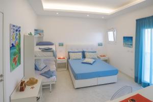 Ένα ή περισσότερα κρεβάτια σε δωμάτιο στο Hotiday Rooms Torre Lapillo