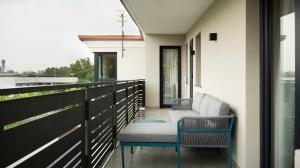 a balcony with two chairs and a table at Domino Suite House in Striano