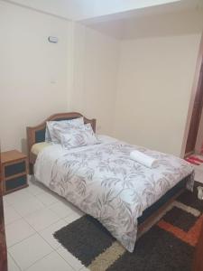 Ένα ή περισσότερα κρεβάτια σε δωμάτιο στο Brames Homes