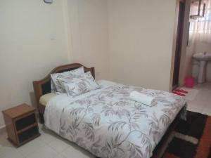 Ένα ή περισσότερα κρεβάτια σε δωμάτιο στο Brames Homes