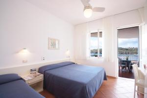 Postel nebo postele na pokoji v ubytování Hotel Dino