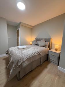 Ένα ή περισσότερα κρεβάτια σε δωμάτιο στο BritLodge Home