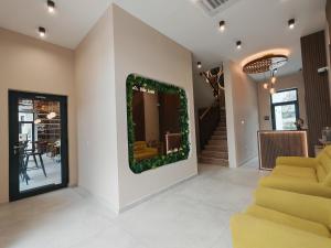 a living room with a christmas wreath on the wall at POOL RESORT Vila Lena - Lux residence apartman 1 in Vrdnik