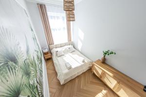 Postel nebo postele na pokoji v ubytování Ola Grand Apartment Sauna & Jacuzzi + 30 fotografií