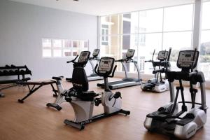 a room with a bunch of exercise bikes in a gym at Suithauz Studio in Kuantan
