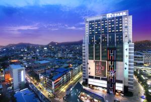 a city with tall buildings and a clock tower at Hotel Skypark Kingstown Dongdaemun in Seoul