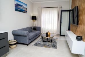 a living room with a couch and a table at Real Kee in Midrand