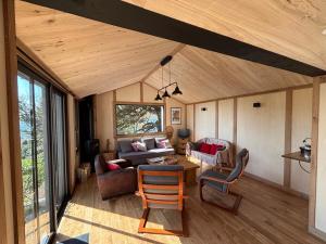 a living room with a couch and a table at Kerélec in Carantec