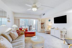 a living room with a couch and a flat screen tv at Bluewater East 407 S in Ocean City
