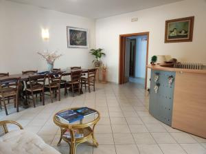 a dining room with a table and chairs at Nonno Pierino affittacamere in Civitella Casanova