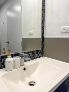 a bathroom sink with a mirror and a sink at Condo for rent by phuket sweet home chalong in Ban Klang +5 photos