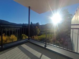 a balcony with a view of the sun at Panorama Wildgrat in Wenns