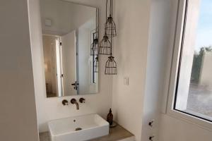 a bathroom with a sink and a mirror at Quinta do Alvisquer in Alvisquer +14 photos