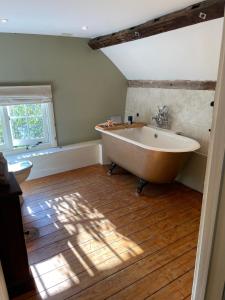 a bathroom with a large tub and a window at Bartley Mill in Wadhurst +94 photos