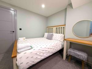 Ένα ή περισσότερα κρεβάτια σε δωμάτιο στο The Modern Muse