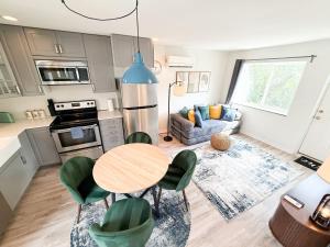 a kitchen and living room with a table and chairs at Charming B&B Mezzanine with Free Parking! in Washington
