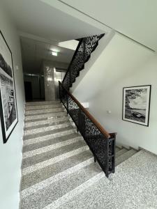 a staircase in a house with a stair case at Birstonas Holidays Apartment in Birštonas