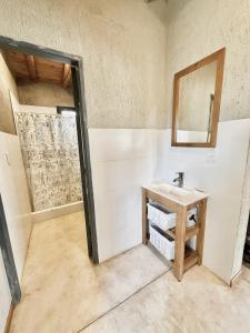 a bathroom with a sink and a mirror at Wabi sabi, casita de montaña con pileta in Mendoza +56 photos