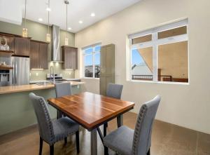 a kitchen with a wooden table and chairs at Modern Mountain Retreat Single Level Living in Glenwood Springs