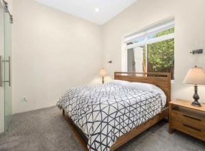 a bedroom with a bed and a window at Modern Mountain Retreat Single Level Living in Glenwood Springs