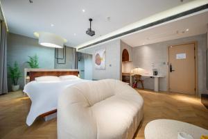 Ένα ή περισσότερα κρεβάτια σε δωμάτιο στο Qiyu Hotel - Xian Bell Tower