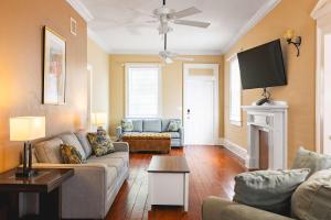 a living room with a couch and a fireplace at Sweet Caroline in Key West