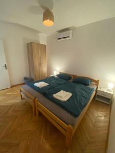 a bedroom with a large bed in a room at Welcome to our vacation home in Sutomore in Sutomore