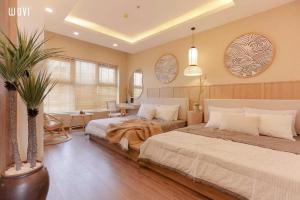 Ένα ή περισσότερα κρεβάτια σε δωμάτιο στο FLC Sea Tower - Kimi Apartment