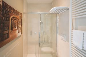 a bathroom with a shower and a toilet at Lullaby B&B in Treviso